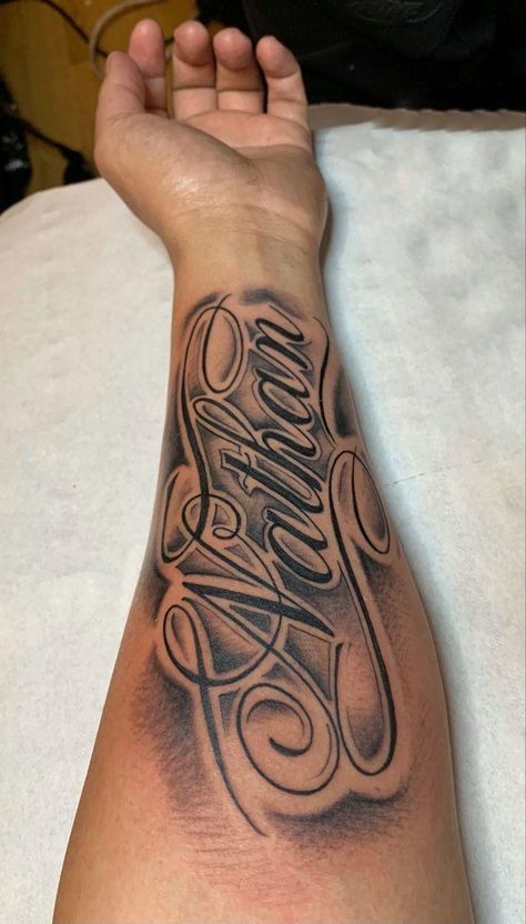 Name Style Tattoos, Arm Tattoos For Guys Forearm Ideas, Name Tattoo On Bicep, Name Tattoo With Shading, Last Name On Arm Tattoo, Men Name Tattoos For Women, Sleeve Tattoos With Names, Men’s Name Tattoos, Unique Name Tattoos For Men