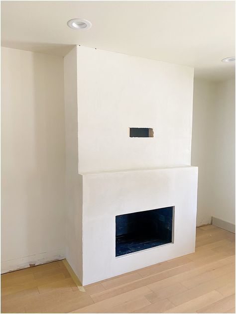 Fireplace Addition Diy, White Concrete Fireplace Surround, Line Wash Fireplace, Cement Fireplace Diy, Limewashed Fireplace, Micro Cement Fireplace, Faux Concrete Wall Fireplace, White Concrete Fireplace, Roman Clay Fireplace With Mantel