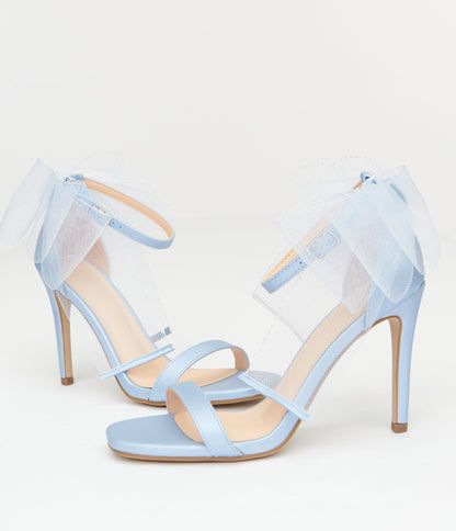 Crafted for those who love to stand out, these stunning heels feature an enchanting tulle bow that adds a playful touch to any outfit. The soft baby blue hue is perfect for making your ensemble pop! With an adjustable ankle strap and open toe design, comfort meets style in every step you take. Complete with a 4 inch heel.Available while supplies last. Stunning Heels, Blue High Heels, Tulle Bow, Tulle Bows, Blue Tulle, Blue Heels, Every Step You Take, Soft Baby, Toe Designs