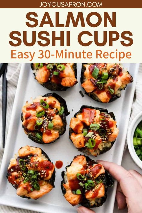 Salmon Sushi Cups - a fun twist to Japanese sushi rolls! Baked in a muffin tin, chewy sushi rice is wrapped in nori and topped with baked salmon, chopped green onions, furikake, unagi sauce and sriracha sauce. Mini Sushi Cups, Salmon Sushi Cups, Sushi Cups, Joyous Apron, Traditional Sushi, Salmon Sushi Rolls, Unagi Sauce, Sushi Bake, Salmon Roll