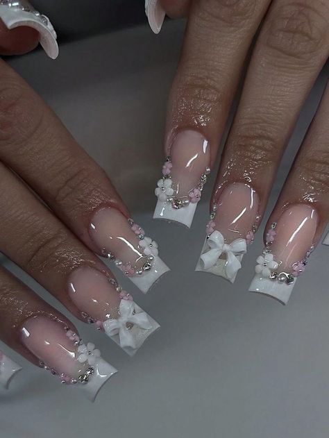 #whitenail #nails #whitenails #nailart #inspire #blingnails #fallnails #almondnails #explorepage #ombrenails #summernail #nudenail #getnailed #dmv #ombr #dmvnailtech #glowup #glownails #springnails #stilletoes #mylarnails #dopenailtechs #fallcolors #qualitynails #nailsofinstagram #nail #naildesigns #fredericksburgnailtech #nailsnailsnails #nailsaddict Wedding Nails With Rhinestones And Pearls, Elegant Bling Nails, Nail Ideas Acrylic Charms, Bow And Flower Nails, Birthday Nails Glam, Nail Charm Placement, Medium Acrylic Nails With Charms, Gel Nails Ideas White, 3d Flower French Tip Nails