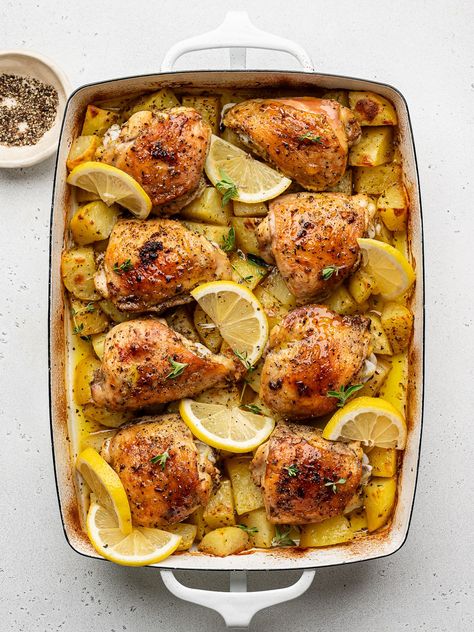 Greek Chicken and Potatoes - Sandra Valvassori Greek Roasted Chicken And Potatoes, Whole Cut Up Chicken Recipes, Cut Up Chicken Recipes, Baked Chicken Thighs And Potatoes, Baked Greek Chicken Thighs, Chicken With Beans, Lake Meals, Dinner Greek, Chicken Thighs And Potatoes