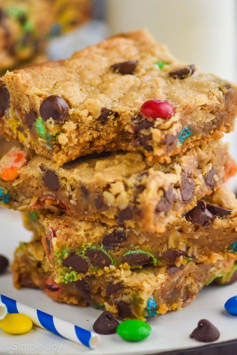 Monster Cookie Bars are so easy to make, and full of delicious flavor. Such a fun treat to bake with the kiddos! Monster Bar Cookies, Sheet Pan Bars, Monster Bars, Monster Cookie Bars Recipe, Monster Bar, Cookie Bars Easy, Monster Cookie Bars, Monster Cookie, Jelly Roll Pan