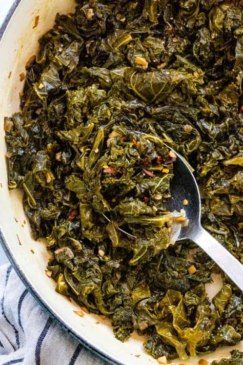 Braised kale is a simple way to tenderize and deepen the flavor. The greens first saute to maximize the aromatics in the dish then get covered and simmer. #kale #braisedkale #healthyrecipes #sidedish Stewed Kale Recipes, Soul Food Kale Greens, Hot Kale Recipes, Kale Southern Style, Braised Greens Recipes, Kale Greens Recipe Southern Vegan, Southern Kale Greens, Southern Kale Recipes, Boiled Kale Recipes