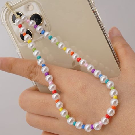 PRICES MAY VARY. Colorful, lively and super funny, These phone charm are made of colorful smiley beads,heart beads,letter beads,fruit beads and so on.It is a lovely design for women and girls to make them more attractive. The perimeter of the phone lanyard is about circumference 28cm(11 inch )+5cm(1.97 inch).They are made of acrylic and soft ceramic artificial beads.It is very suitable for ladies and girls.It is very suitable for ladies and girls.You can loop the strap through your mute button h Wrist Lanyard, Bead Charms Diy, Clay Bracelet, Hand Wrist, Beads Bracelet Design, Phone Strap, Rainbow Beads, Diy Charms, Heart Beads