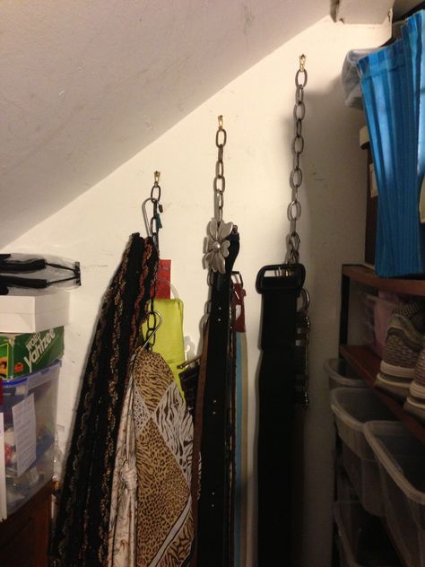 A cheap way to store light weight things such as belts, scarves and hats.  I strung lamp chain from a heavy duty picture frame hook then used large sized "s" hooks to hang my belts and scarves.  It's very functional but not very pretty but it is hidden on a wall inside my closet. Diy Belt Hanger, Sneaker Room, Attic Decor, Diy Hooks, Chain Clothing, Belt Display, Belt Hanger, Scarf Organization, Diy Belts