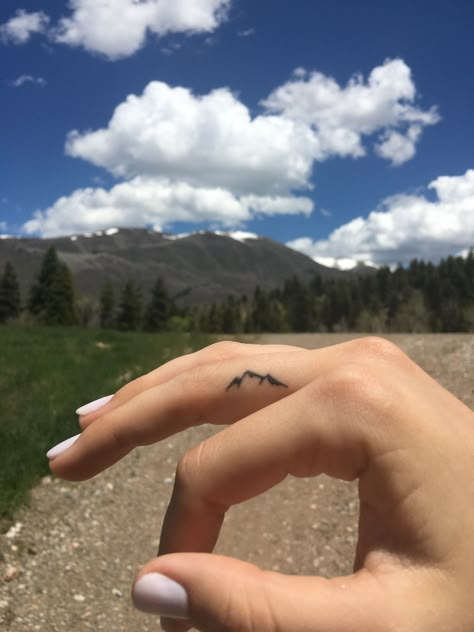 Moutain Tattoos Finger, Small Bear And Mountain Tattoo, Mountain Peak Tattoo Simple, Mountain Tattoo Behind Ear, Mountain Finger Tattoo Simple, Glacier National Park Mountain Tattoo, Mountain Tattoo On Finger, Up North Tattoo, Finger Tattoos Mountain