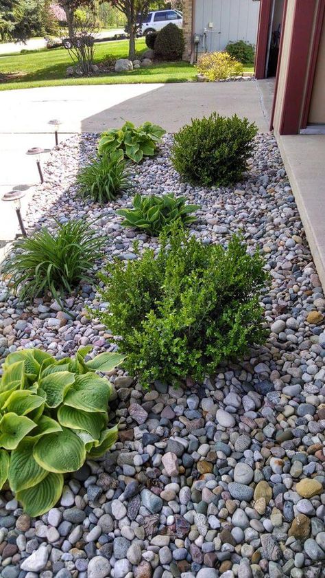 39 Attractive Low-maintenance Gardens For Your Landscaping Simple Landscaping Front Yard Low Maintenance With Rocks, Low Maintenance Driveway Landscaping, River Rock Front Yard, River Rock Around House Foundation, Low Matienence Landscaping, Low Maintenance Landscaping Front Yard Full Sun, Rock Side Yard, Low Maintenance Landscape Ideas Front Yard Stones Rock Border, Gray Rock Landscaping