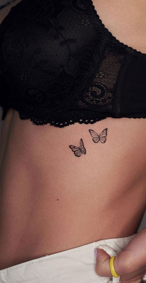 75 Unique Small Tattoo Designs & Ideas : Two Butterflies I Take You | Wedding Readings | Wedding Ideas | Wedding Dresses | Wedding Theme Butterflies With Words Tattoo, Rib Tattoo Minimalist, Butterfly Tattoo Rib Cage, Butterfly Underboob Tattoo, Butterfly Tattoo Under Breast, Sa Tattoo Ideas, Butterfly Rib Tattoo, Tato Grunge, Tato Geisha