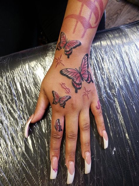 Tattoos Aesthetic Black Women, Pink Tattoos On Black Women, Red Hand Tattoo Black Women, Red Butterfly Hand Tattoo For Women, Hottie Tattoo Ideas, Red Butterfly Hand Tattoo, Red Sternum Tattoo Black Women, Raw Tattoos For Women, Red Tattoo On Black Women Dark Skin