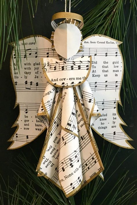 This sheet music angel ornament is included in a round up of handmade paper tree ornaments Hymnal Crafts, Sheet Music Ornaments, Music Christmas Ornaments, Sheet Music Crafts, Music Ornaments, Paper Christmas Ornaments, Music Crafts, Instruções Origami, Christmas Tree Decorations Diy