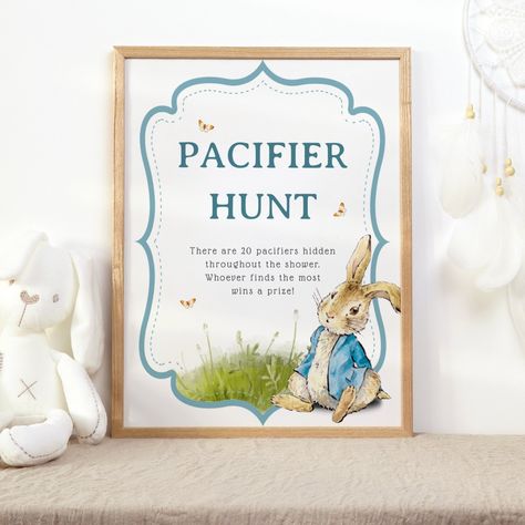 Pacifier hunt baby shower game poster featuring a cute illustration of Peter Rabbit. Boy baby shower idea. afflink Peter Rabbit Baby Shower Ideas Boys, Neutral Posters, Peter Rabbit Baby Shower Ideas, Peter The Rabbit, Pacifier Hunt, Boy Pacifier, Garden Baby Shower Theme, Bunny Sitting, Rabbit Vintage