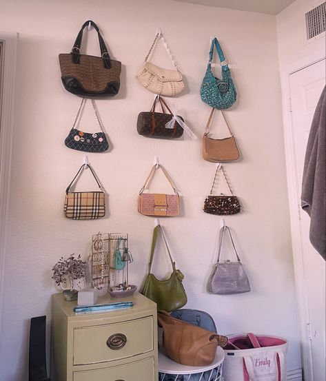 purse wall, room decor, purse display, purses, wall art Purses On Wall Aesthetic, Handbags On Wall, Bedroom Handbag Display, Bag Hooks Wall Bedroom, Room Purse Display, Purse Hanging Ideas Bedrooms, Creative Purse Display, Bag Hooks Wall, How To Hang Purses