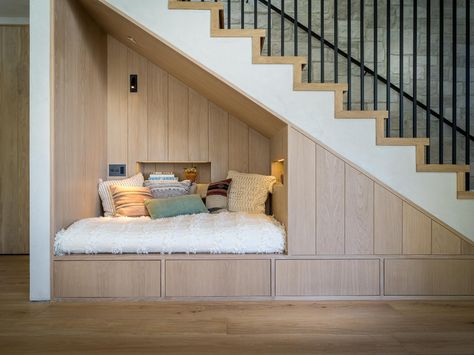 A Seating Nook Under The Stairs Offers A Quiet Place To Read In This Home Bed Under The Stairs, Under Stairs Nook, Stair Nook, تحت الدرج, Staircase Storage, Under The Stairs, Built In Seating, Understairs Storage, Stair Storage