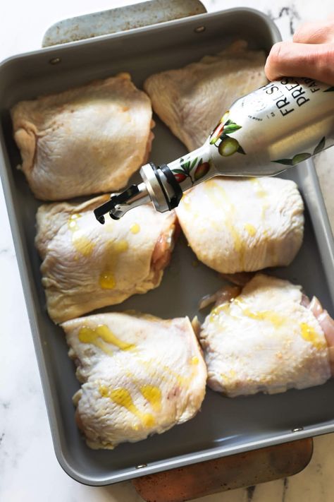 The flavor of these perfectly roasted chicken thighs is incredible. This easy 5-ingredient oven-baked bone-in chicken thigh recipe is the perfect staple recipe and easy weeknight dinner. These low-carb chicken thighs are super-juicy with the crispy skin you want. Use this recipe for meal prep and batch cooking too. | Real Simple Good Skin On Chicken Thigh Recipes Oven Baked, Quick Bone In Chicken Thigh Recipes, Skinned Chicken Thigh Recipes, Chicken Thigh Marinade For Oven, Baked Chicken Thigh Recipes Bone In, Simple Chicken Thigh Recipes Easy, Recipes For Bone In Skin On Chicken Thighs, Chicken Thighs With Bone And Skin, Cast Iron Chicken Thigh Recipes