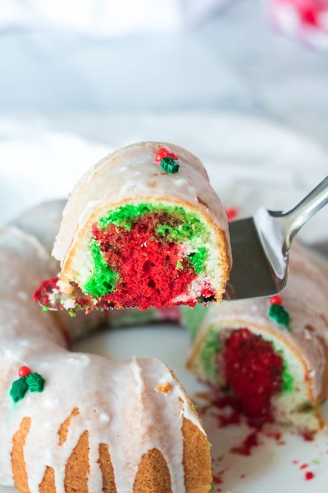 Impress your friends and family this holiday season with this easy to make Christmas Bundt Cake. With swirls of red and green making a festive appearance when sliced, the icing on the cake is a drizzled glaze that's garnished with holly and berry decorative sprinkles. Christmas Bundt Cake Recipes, Holiday Cake Recipes, Christmas Bundt Cake, Bundt Cake Recipes, Delicious Holiday Desserts, Country Cook, The Country Cook, Bundt Cakes Recipes, Box Cake Mix