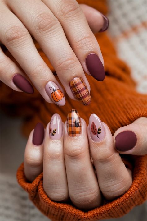 Embrace the cozy vibes of Fall with these adorable nail art designs that celebrate the beauty of autumn! Picture your nails adorned with warm tones of burnt orange, deep reds, and golden yellows, featuring charming leaf patterns or tiny pumpkins. These cute nail ideas are perfect for showcasing your seasonal spirit while adding a playful twist to your look. Get inspired and bring the essence of Fall to your fingertips! Nail Art With Pumpkins, Fall Nails Ideas Pumpkin, Round Autumn Nails, Autumn Color Nails Fall, Fall Nails Pattern, Thanksgiving Nail Designs Almond, Red Nails Fall Design, Short Almond Nails Thanksgiving, Cozy Nails Aesthetic