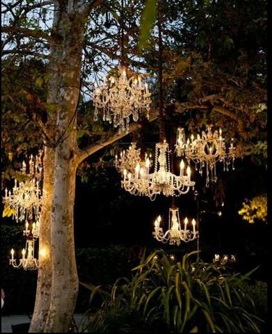 There’s nothing quite like a chandelier. Their romantic elegance and wide array of designs provide endless possibilities for home décor. As the summer winds dow Outdoor Evening, Wedding Chandelier, Outdoor Chandelier, Outdoor Chandeliers, Salou, Evening Wedding, Summer Dinner, Forest Wedding, Wedding Lights