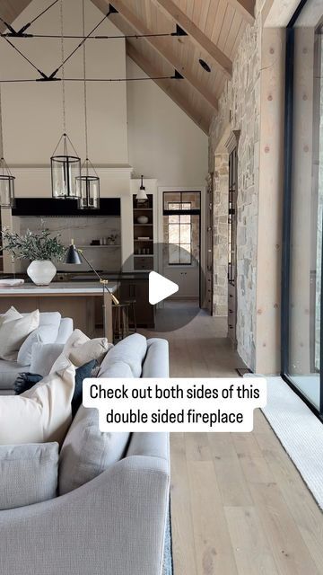 Check out this open double sided fireplace in the great room and library of our #threefallsproject! 🤍🤍🤍  Build @splitrockcustomhomes and @grovehomesutah Arch @stevetiek Double Sided Fireplace With Wood Storage, Two Sided Stone Fireplace, Two Sided Fireplace Living Room, The Architect Nikki Sloane, Entryway With Fireplace, Becki Owens Living Rooms, Non Centered Fireplace, Fireplace Next To Front Door, Two Story Living Rooms