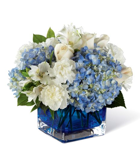 A soft, charming, and stylish flower bouquet, this arrangement exudes warmth and light in celebration of Hanukkah helping you celebrate with those recipient's close to your heart. Clouds of blue hydrangea standout amongst the clean white of... Light Bouquet, Blue Flower Arrangements, Hydrangea Flower Arrangements, Flower Factory, Peace Light, Blue Centerpieces, Blue Hydrangea Flowers, Peruvian Lilies, Flowers For You