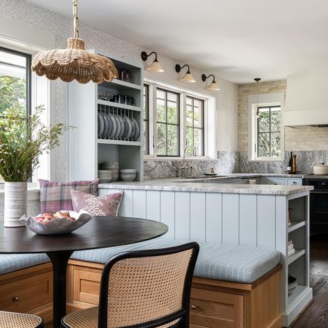 When planning the layout with the client on this kitchen renovation, we quickly realized that a peninsula made more sense for the space than an island, and allowed us to create this cozy breakfast nook, centered across from an existing fireplace. 📷: @ianmichelman Built In Bench Kitchen Peninsula, Kitchen Peninsula Banquette, Breakfast Nook Off Island, Peninsula With Banquette Seating, Banquette Seating Against Kitchen Island, Kitchen Peninsula Breakfast Nook, Breakfast Nook Attached To Island, Open Concept Kitchen With Breakfast Nook, U Kitchen Layout With Peninsula