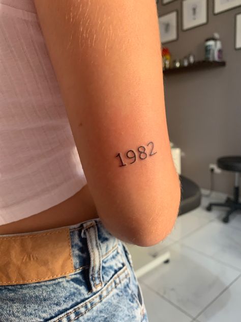 Back Of Arm Date Tattoo, Date Above Elbow Tattoo, Birthday Tattoo Back Of Arm, Tattoo Date Of Birth Numbers, Date On Back Of Arm Tattoo, Dates On Back Of Arm Tattoo, Numbers On Back Of Arm Tattoo, 2010 Tattoo Number, Back Of Arm Number Tattoo