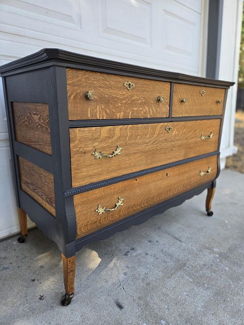 This four drawer antique caster wheels dresser is a statement piece for any style interior home wether it's eclectic or industrial, to a moody gothic or rustic, to modern or cottage core - with its sophisticated elegance it'll fit any room or space that you can picture it in. This piece was freshened up and revamped with a two tone look of paint and stain. Brand new vintage style caster wheels were added. The top does have some slight separation but nothing to major or to noticeable as shown in Antique Dressers Makeover, Stained And Painted Dresser, 2 Tone Dresser Black And Wood, Black And Copper Dresser, Black Painted Antique Dresser, Antique Dresser Makeover, Western Dresser Furniture Black, Stained Dresser, Black And Wood Antique Dresser