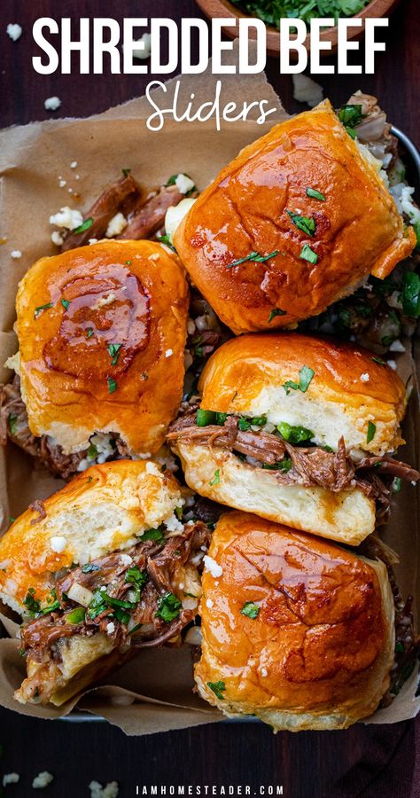 Sliders in a parchment lined tray, some turned on their side. Flank Steak Shredded Beef, Shredded Beef Meal Ideas, Chopped Beef Sliders, Roasted Beef Sandwich Recipes, Beef Brunch Ideas, Crockpot Beef Sliders Recipes, Crowd Meals Dinners, Essen, Bbq Shredded Beef Sandwiches