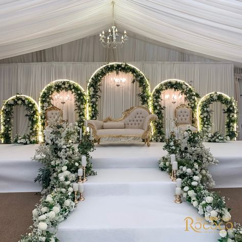 Absolutely loved creating this stunning wedding decor! 🤍 Swipe to see one of our favorite setups yet. #WeddingDecor #EventStyling Decor: @rococo.events Venue: @keythorpemanor #weddingdecorators #weddingdecorinspiration #eventdecorators #floraldecoration #weddinginsporation #ukweddingplanners #floralwedding white, green, gold, wedding theme, staging, archway, floral arch, table decor Wedding Events Decoration, Floral Wedding Entrance Decor, Wedding Stage White Theme, Green And White Wedding Stage Decor, White Floral Stage Decor, Wedding Decor Set Up, White And Green Themed Wedding, Wedding Decoration Green And White, Off White Wedding Decor