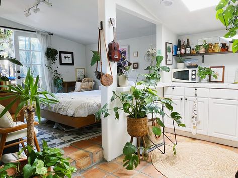 Check out this Mid-Century Boho Small/Cool Space | Apartment Therapy Small Cozy Apartment Sofas, Midcentury Modern Small Apartment, Small Basement Studio Apartment, Bohemian Small Apartment, Vintage Studio Apartment, Plants In Small Apartment, 1 Room Apartment, Small Japanese Apartment, Artsy Apartment