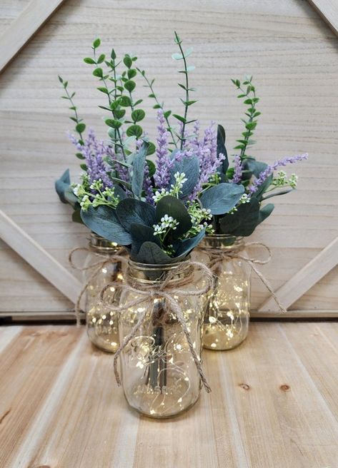 lavender eucalyptus wedding - Google Search Lavender And Bronze Wedding, Lavender In Mason Jars, Lilac Mason Jar Centerpieces, Lilac Eucalyptus Wedding, Lavender Center Piece Wedding, Lavender And Succulent Wedding, Sage Green And Purple Wedding Centerpieces, Sage And Lavender Centerpieces, Cottagecore Wedding Table Decor