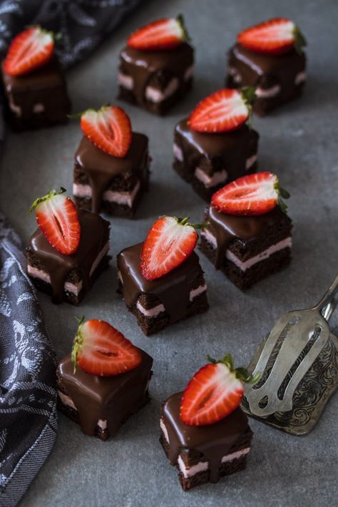 These Strawberry and Chocolate Petit Fours are easy to make chocolate cake filled with strawberry buttercream and topped with chocolate ganache. A cute sweet treat for Mother’s Day, a birthday or afternoon tea. Funnel Cake Toppings, Chocolate Petit Fours, Easy Funnel Cake, Funnel Cake Recipe Easy, Petit Four Recipes, Mini Chocolate Cake, Strawberry And Chocolate, Strawberry Buttercream, Strawberry Chocolate