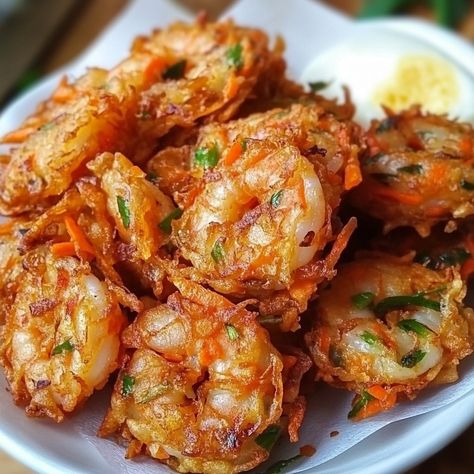 🦐 "Crispy, savory, and oh-so-delicious! Try Ukoy (Shrimp Fritters) for the perfect snack or appetizer!" 🍤 #Ukoy #FilipinoFood Ukoy (Shrimp Fritters) Ingredients: Small shrimps, unpeeled (1 cup) Bean sprouts (1 cup) Sweet potato, julienned (1 cup) Carrots, julienned (0.5 cup) All-purpose flour (0.75 cup) Cornstarch (0.25 cup) Water (0.75 cup) Egg, beaten (1) Salt (0.5 tsp) Pepper (0.25 tsp) Cooking oil (for frying) Instructions: In a bowl, mix flour, cornstarch, water, beaten egg, salt, an... Shrimp Fritters, Cozy Fall Recipes, Salted Egg, Festive Drinks, Bean Sprouts, Hearty Soups, Filipino Recipes, Cooking Oil, Savoury Dishes