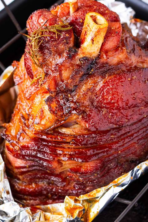 Brown Sugar Glazed Ham! This baked ham is made with a brown sugar glaze. It's moist, tender, and so delicious. This glazed ham is perfect for the holidays. Glazed Bone In Ham Recipes, How To Bake A Smoked Ham In The Oven, Bone In Ham Glaze Recipe, Baked Ham With Brown Sugar Glaze, Honey Baked Ham In Electric Roaster, Glaze Ham Recipes Brown Sugar, Smoked Ham Recipes Ovens, Ham Roaster Oven, Glaze For Hickory Smoked Ham