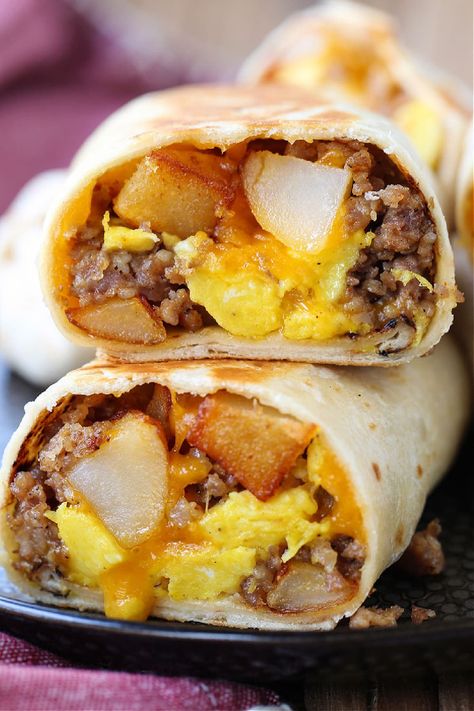 Freezer Breakfast Burritos make mornings on the go easy! Heat in the microwave from frozen and in minutes you have a hearty, delicious meal! Breakfast Burritos For A Crowd, Breakfast Sandwich Meal Prep, Frozen Lunches, Freezer Burritos, Potatoes And Eggs, Make Ahead Breakfast Burritos, Easy Breakfast Burritos, Frozen Burritos, Portable Breakfast