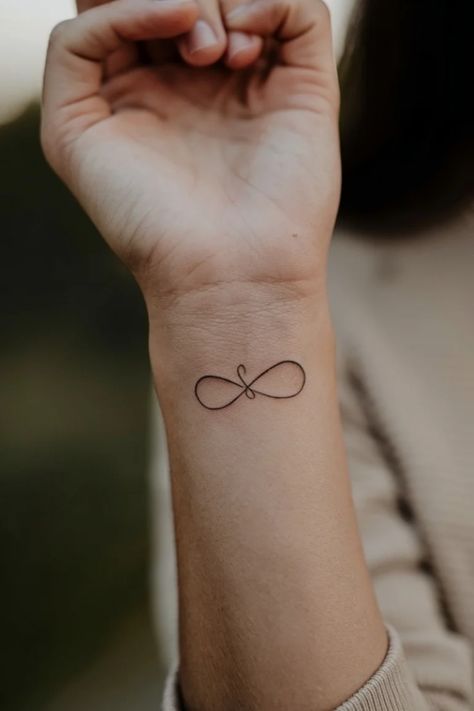 Infinity symbol tattoo on a person's wrist. Heart And Infinity Tattoo, Trust Symbol, Infinity Symbol Tattoos, Infinity Sign Tattoo, Tattoo Ideas For Females, Infinity Tattoo On Wrist, Meaningful Tattoo Ideas, Infinity Symbol Tattoo, Unique Tattoo Ideas