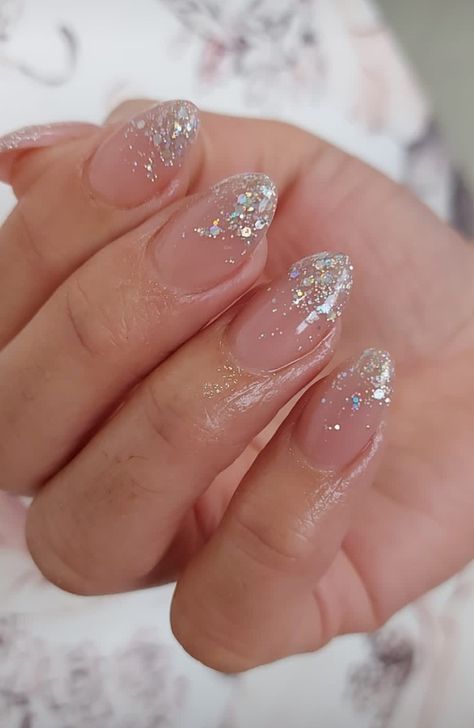 Glitter Tips Almond Nails, Short Oval Glitter Nails, Silver Glitter French Tip Nails Almond, Prom Nails Simple Elegant, Nude Nails Glitter Tips, Ombre Sparkle Nails Almond, Sparkly Ombré Nails, Falling Glitter Nails, Glittery Tips Nails