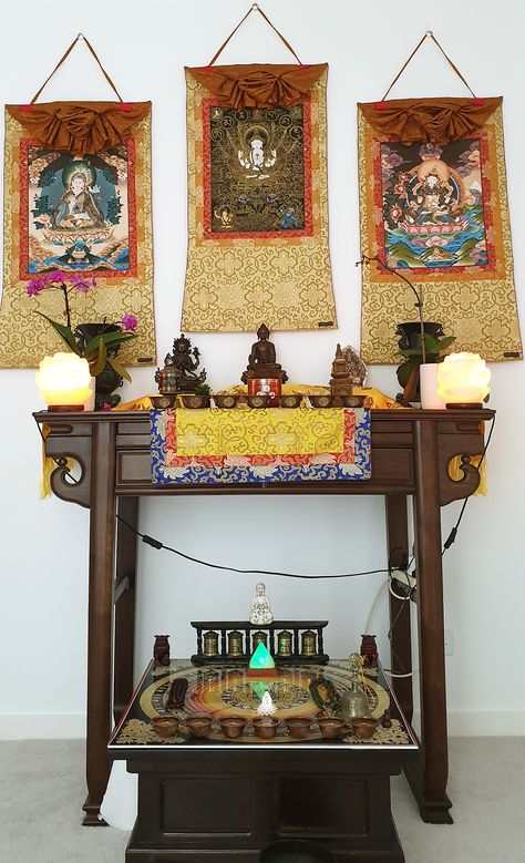 Buddhist altar with statues and thangka paintings Tibetan Buddhist Altar, Buddhist Monastery Interior, Buddhist Altar Design, Buddhist Altar Home Ideas, Buddha Altar Ideas, Buddha Altar Design, Buddhist Altar Home, Japanese Meditation Room, Spiritual Altar Ideas