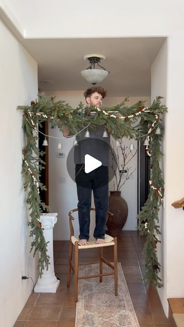 48K likes, 331 comments - lonefoxhome on November 25, 2023: "After @thekwendyhome shared this garland hanging hack, I HAD TO GIVE IT A GO at my parents house!..." Christmas Garland Over Curtains, Xmas Hanging Decorations, Hallway Holiday Decorating, Around The Door Christmas Decor, Hanging Branch Christmas Decorations, Door Way Christmas Garland, How To Make A Cedar Garland, Garland On Ceiling Beams, Sticking Hanging Ideas No Fireplace