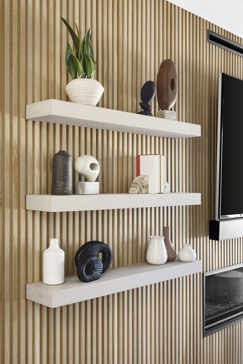 Fluted Wall With Shelves, Wall Panelling With Shelves, Shelves On Slat Wall, Living Room Cladding Wall, Floating Wall Panels, Slat Wall Playroom, Wood Slat Wall With Floating Shelves, Slat Wall Floating Shelves, Slatted Wall With Shelves