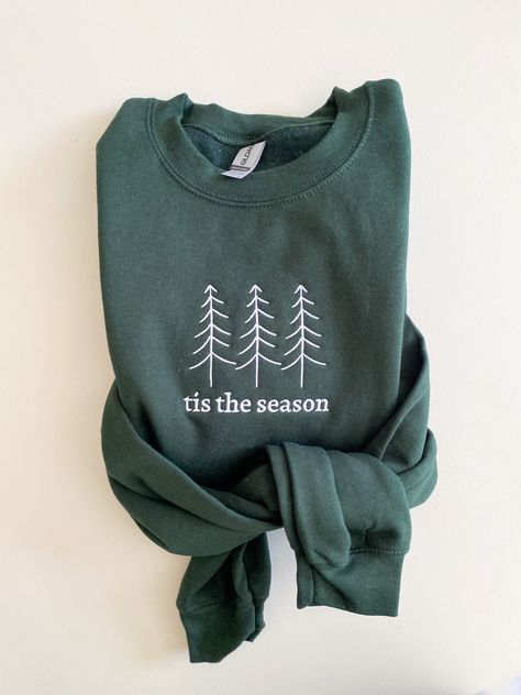 Tis the season! We love this sweatshirt for the holiday season. Professional embroidery with a simplified look for Christmas. -Sweatshirts: Jerzees brand, unisex sizing. *(Gildan or Port & Co brand sweatshirts may be used to fulfill any back orders that may occur) -The most comfortable shirts ever! -EMBROIDERED design! -Personalize by selecting your sweatshirt color and letting us know what design color you would like by leaving us a note in the personalization box! Please reach out with any que Cricut Sweatshirt Ideas, Embroidered Christmas Sweater, Season Tree, Winter Embroidery, Cricut Shirts, Embroidered Christmas, Women Sweatshirt, Christmas Things, Embroidery Sweatshirt