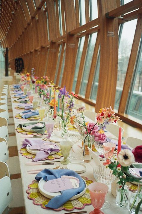 A delightful mix of colorful centerpieces, taper candles, and playful table settings | Image by Cristina Velasco Wildflower Wedding Theme, Art Gallery Of Ontario, Tafel Decor, Ontario Wedding, Eclectic Wedding, Bright Wedding, Garden Party Wedding, Pastel Wedding, Wildflower Wedding