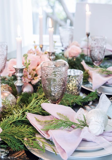 How to create an EASY and BEAUTIFUL Christmas tablescape using cedar garland and roses. Below are all the details you need to create your own version of Christmas in the dining room. Pink And Gold Christmas Tablescape, Dusty Pink Christmas Decorations, Pink And Green Christmas Table Setting, Pink Holiday Tablescape, Pink And Gold Christmas Table Decor, Glam Christmas Tablescape, Pink Christmas Centerpieces For Table, Paris Tablescape, Pink Christmas Tablescapes