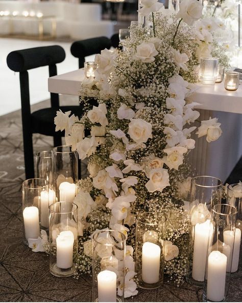 Flowers And Candles Centerpieces Wedding, Souviner Wedding Ideas, Modern Elegant Aesthetic, Hanging Dance Floor Installation, White Rose Table Runner, Gorgeous Wedding Flowers, Candles At A Wedding, Wedding Table Decorations White Flowers, Wedding Table With Candles And Flowers