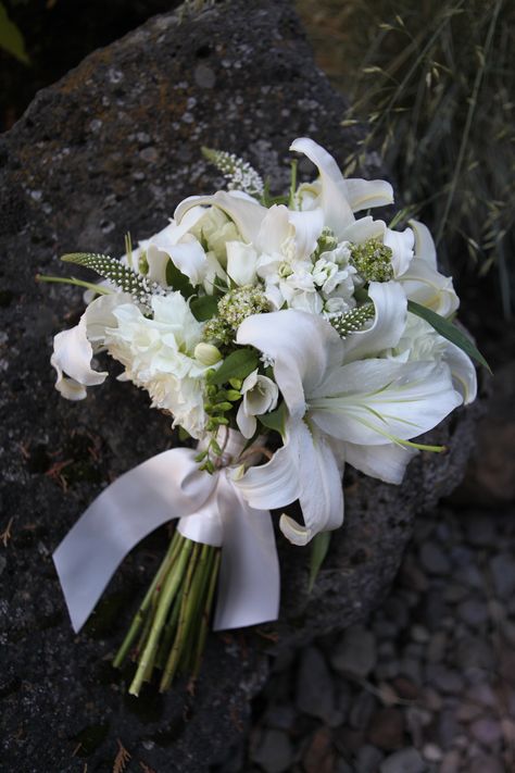 This was an all white bouquet with lilies we created, but can do something similar to this with stargazers lilies, maybe some soft pink and cream garden roses..... Bridal Bouquet Lily, Bouquet Wedding Lilies, Wedding Bouquet With Lilies, Lily And Rose Bouquet, Bridal Bouquet Lilies And Roses, White Lilies And Roses Bouquet, Bouquet Of White Lilies, Stargazer Wedding Bouquet, Lily Wedding Bouquet