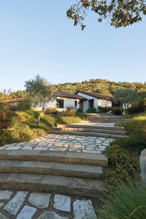 When Jeff Webster and Kimberly Clemenson began their search for a home in which to spend their retirement years enjoying the pleasant microclimate of the Carmel Valley, they knew their expectations were almost absurdly high. They wanted substantial acreage and charm, an opportunity to create a “gentleman’s farm” with an expansive vegetable garden and orchard, Tropical Ranch House, California Ranch Home, California Ranch Aesthetic, New Mexico Ranch House, Arizona House Exterior, Ranch House Aesthetic, Ranch Exterior Ideas, Stone Ranch House, California Ranch Style Homes Exterior