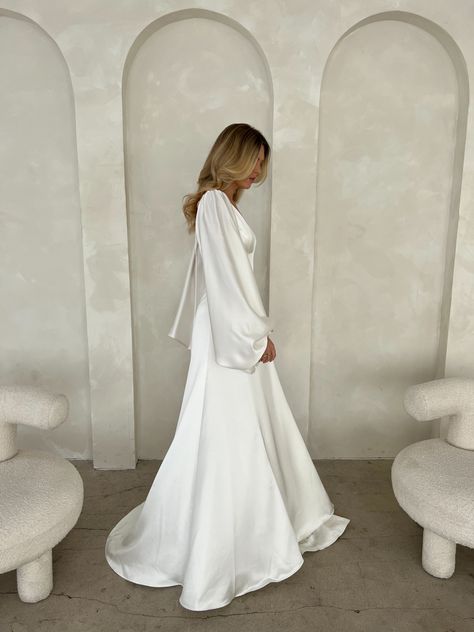 Wedding Dress Sleeves Satin, Long Sleeve Flowy Wedding Dress Simple, Long Sleeved Backless Wedding Dress, Long Sleeved Silk Wedding Dress, White Satin Modest Dress, White Bishop Sleeve Dress, Super Flowy Dress, Slouchy Wedding Dress, Wedding Dress Long Flowy Sleeves