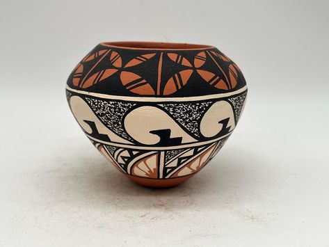 This beautiful Native American Jemez Pottery vase is a stunning piece of art created by Francisco Chinana. Being handmade this vase is a true representation of Native American culture. The intricate design and craftsmanship are a testament to the artisan's skill. The details of the vase highlight the tribal affiliation of the artist and showcase the beauty of the Native American culture. Perfect for collectors of pottery and enthusiasts of Native American art, this vase is a timeless piece that will add value to any collection. This vase measures 3 1/4" tall and 4" wide. Native American Pottery, Zentangle Drawings, American Culture, Native American Culture, Keramik Vase, Native American Art, Pottery Vase, Intricate Design, Fine Art Ceramics