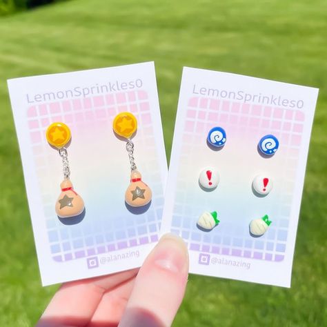 Alana 𓆏 on Instagram: "These animal crossing earrings look so cute together omg The studs on the right are available on my Etsy shop now! The bell earrings are sold out right now, but will be back in the next shop update (May 21st) 😊 Some upcoming things that’ll also be in the shop: clothes, Kirby earrings, and a new necklace that’ll be revealed soon! It goes very well with the joycon earrings 👀" Video Game Earrings, Animal Crossing Jewelry, Animal Crossing Earrings, Acnh Earrings, Kirby Jewelry, Kirby Earrings, Rosie Animal Crossing, Handcraft Earrings, Earring Video