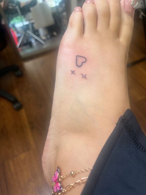 Small Hearts And Stars Tattoo, Heart Feet Tattoos, Tattoo Ideas On The Ankle, Red Ink Finger Tattoos For Women, Hand Poked Tattoo Ideas Design, Different Color Tattoos, Small Cute Thigh Tattoos, 200s Tattoos, Easy Ankle Tattoo